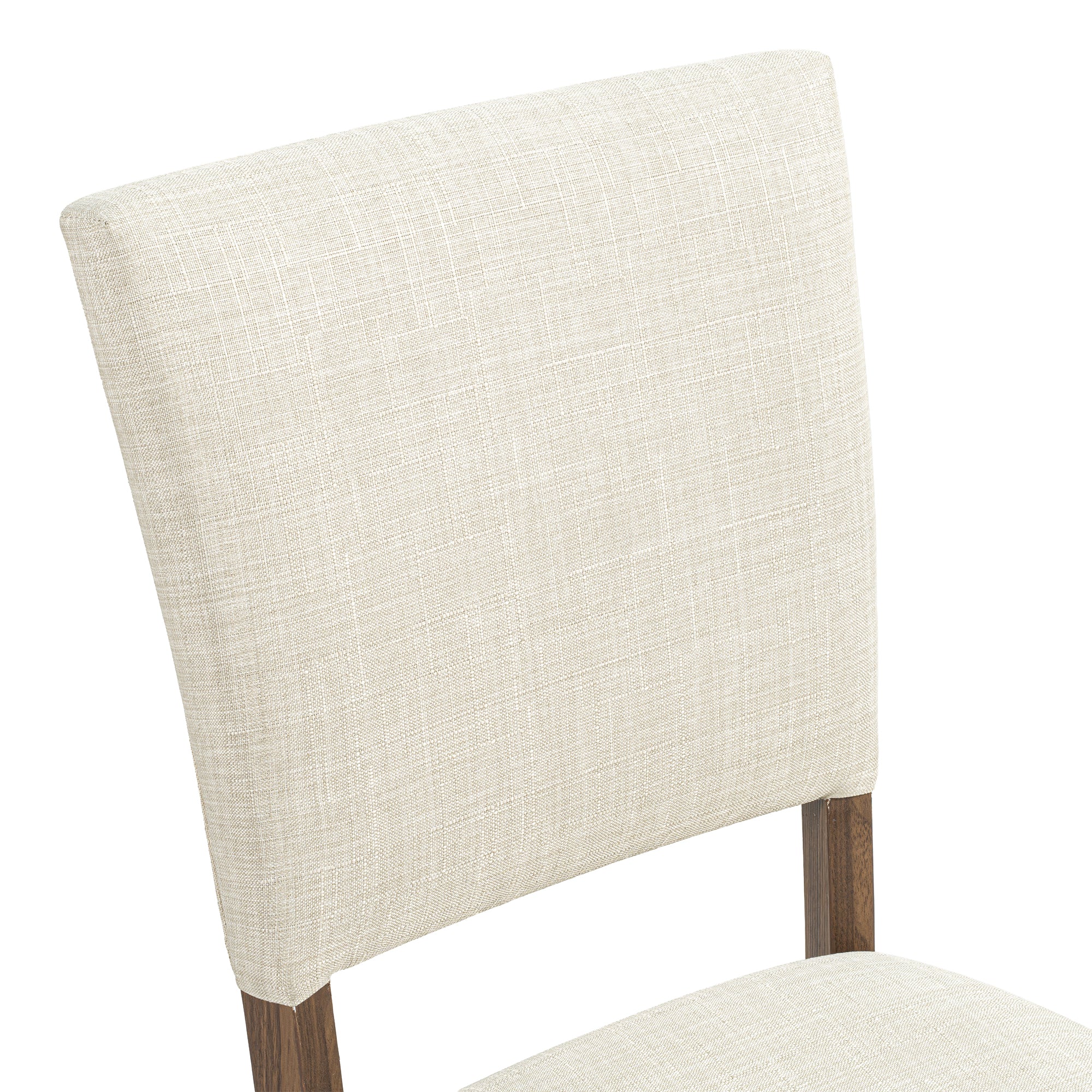 Close-up of a beige fabric upholstered dining chair with dark wood legs