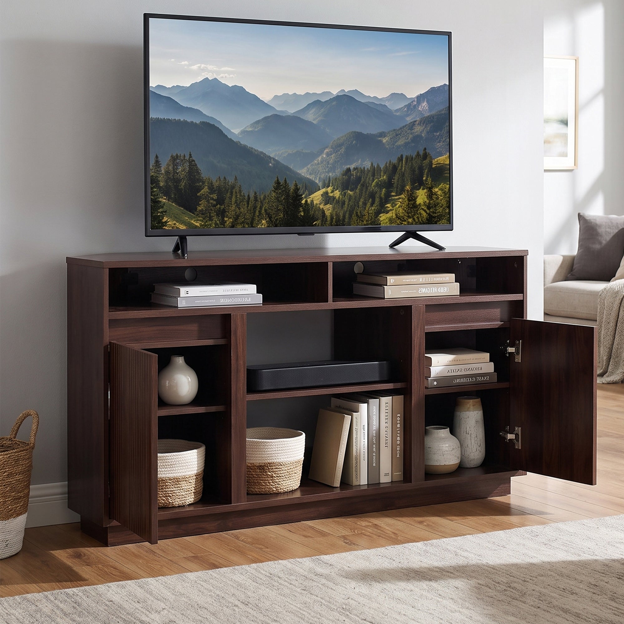 Modern dark wood TV stand with open shelves and cabinets in a bright living room